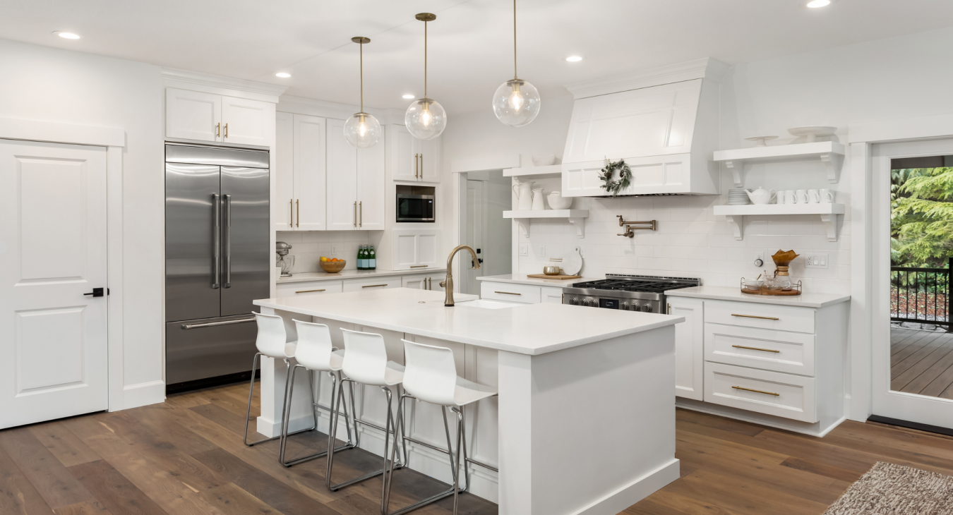 modern white kitchen design with feature pendant lighting and spot lights